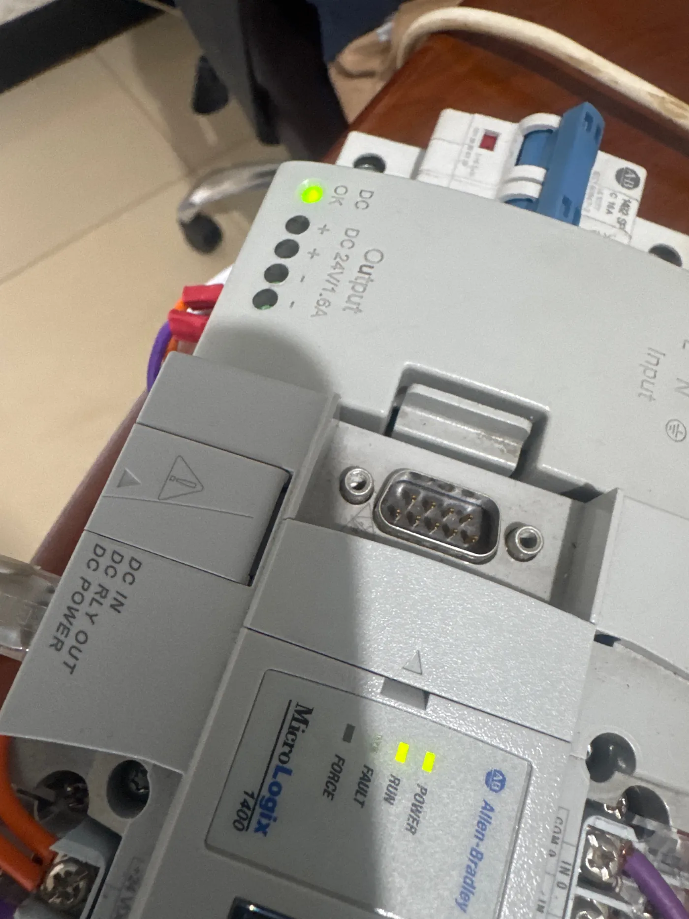Allen-Bradley MicroLogix 1400 PLC powered up on a panel, run and power lights on
