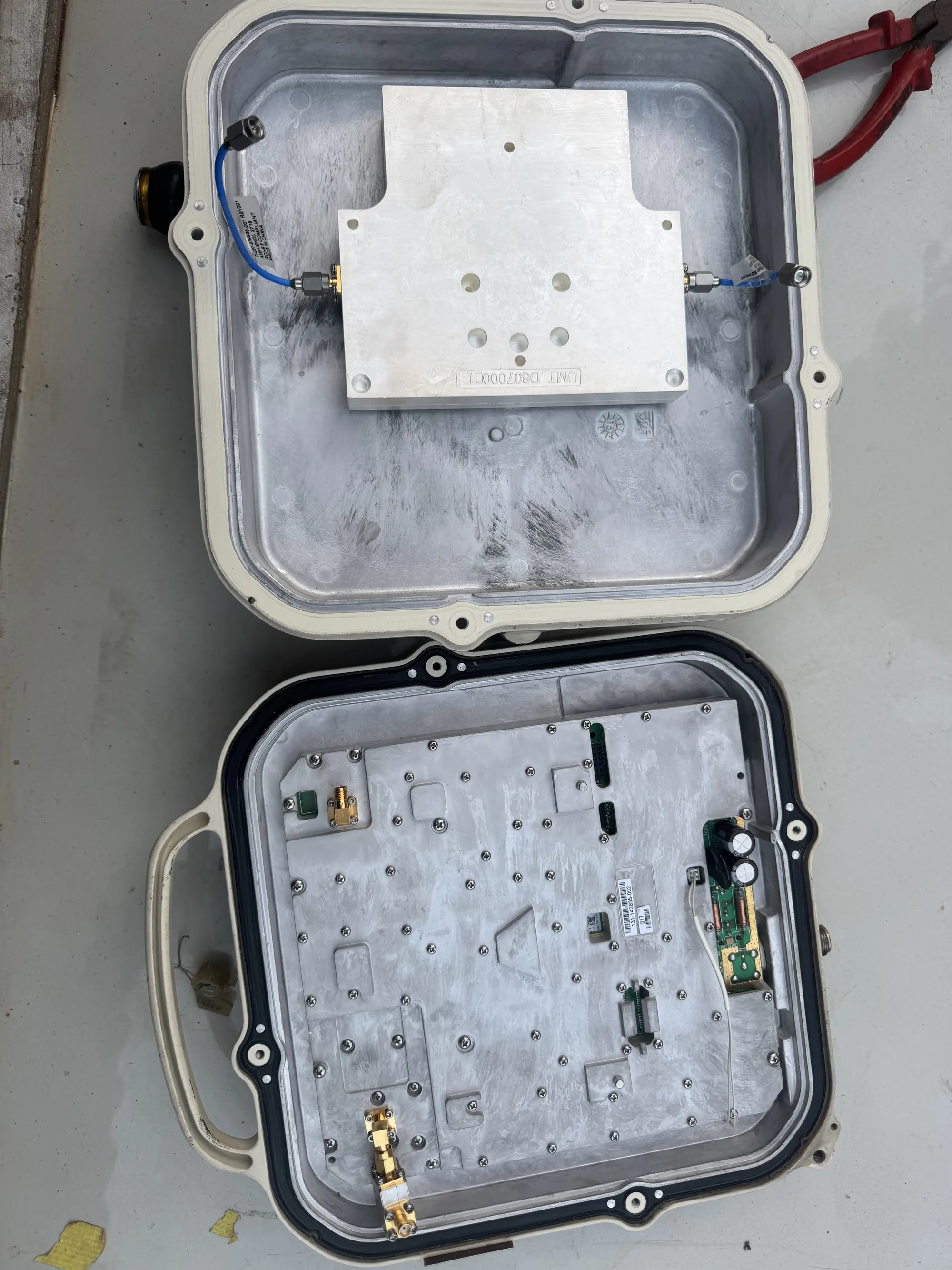 A Huawei RTN outdoor unit opened to show the RF module and housing